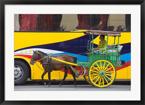 Framed Horse cart walk by colorfully painted bus, Manila, Philippines Print