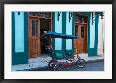 Framed Cuba, Camaquey, bike carriage and buildings Print