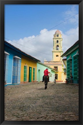 Framed Cobblestone street with cowboy on horse, Trinidad, Cuba Print