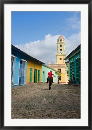 Framed Cobblestone street with cowboy on horse, Trinidad, Cuba Print