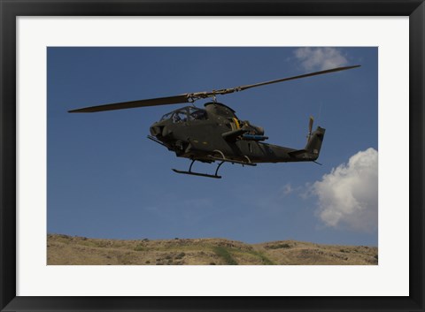 Framed AH-1F Tzefa of the Israeli Air Force flying over the Golan Heights, Israel Print