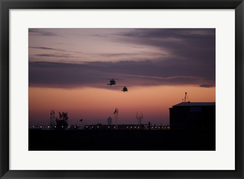 Framed pair of UH-60 Black Hawk helicopters approach their Landing in Baghdad, Iraq Print