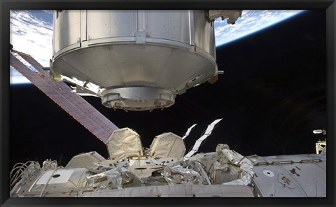 Framed Multipurpose Module in the grasp of Canadarm2 Print