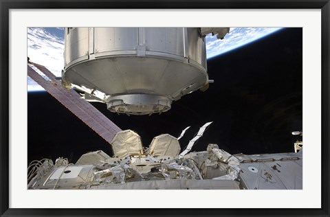 Framed Multipurpose Module in the grasp of Canadarm2 Print