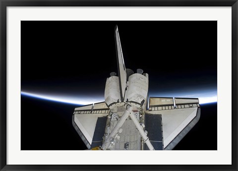 Framed Space Shuttle Discovery Intersecting the Thin line of Earth&#39;s Atmosphere, while Docked with the International Space Station Print