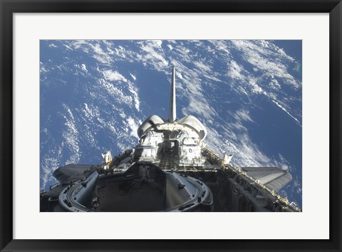 Framed partial view of Space Shuttle Atlantis Backdropped by a Blue and White Earth Print