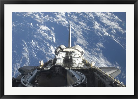 Framed partial view of Space Shuttle Atlantis Backdropped by a Blue and White Earth Print