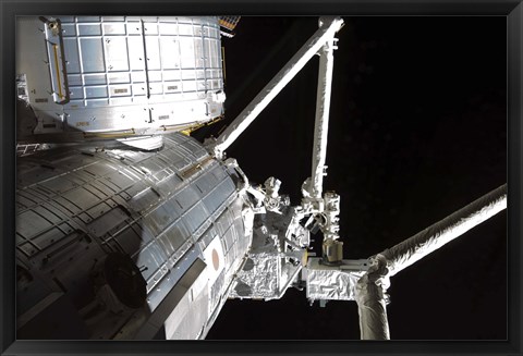 Framed Robotic Arm of the Japanese Experiment Module assists in installing components on the Japanese Exposed Facility Print