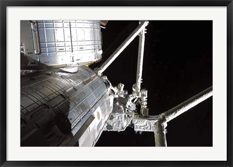 Framed Robotic Arm of the Japanese Experiment Module assists in installing components on the Japanese Exposed Facility Print