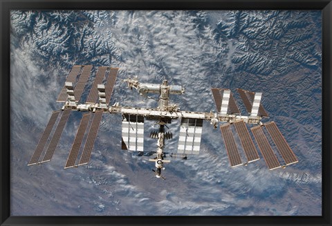 Framed International Space Station Backdropped by a Rugged Earth Terrain Print