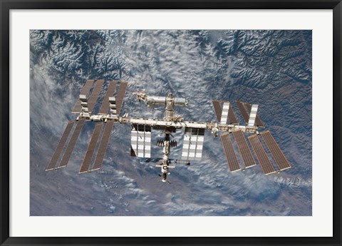 Framed International Space Station Backdropped by a Rugged Earth Terrain Print