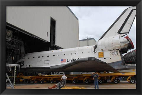 Framed Space Shuttle Atlantis Rolls out of Orbiter Processing Facility 1 at Kennedy Space Center Print