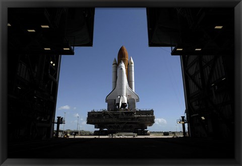 Framed Atlantis Rolls Toward the Open Doors of the Vehicle Assembly Building at Kennedy Space Center Print