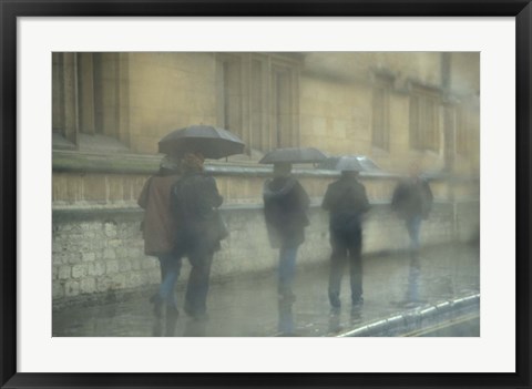 Framed Walking in the rain, Oxford University, England Print