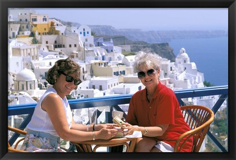 Framed Women Having Coffee on Cafe Terrace, Santorini, Greece Print