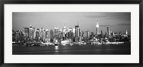 Framed Skyscrapers lit up at night in a city, Manhattan, NY Print