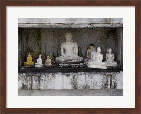 Framed Niche at Ruwanwelisaya Dagoba filled with Buddha statues as offerings, Anuradhapura, Sri Lanka Print