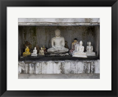 Framed Niche at Ruwanwelisaya Dagoba filled with Buddha statues as offerings, Anuradhapura, Sri Lanka Print