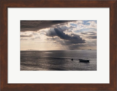 Framed Dramatic light over a little boat, Mamanucas Islands, Fiji, South Pacific Print
