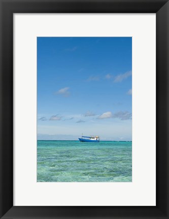 Framed Fishing boat in the turquoise waters of the blue lagoon, Fiji Print