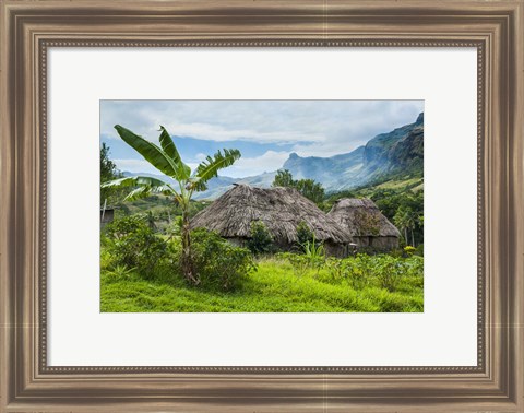 Framed Traditional thatched roofed huts in Navala, Fiji Print