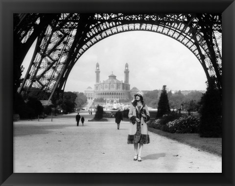 Framed 1920s Woman Walking Under The Eiffel Tower Print