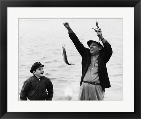 Framed 1950s 1960s Boy Fishing With Father Or Grandfather Print