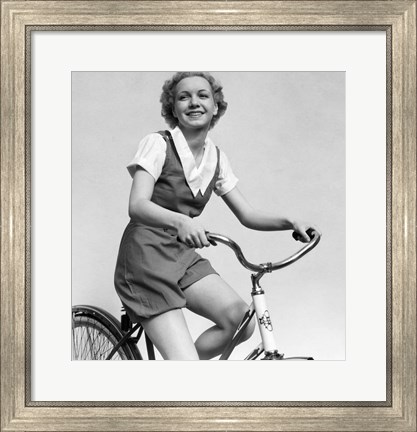 Framed 1930s Smiling Blonde Woman Riding Bicycle Print