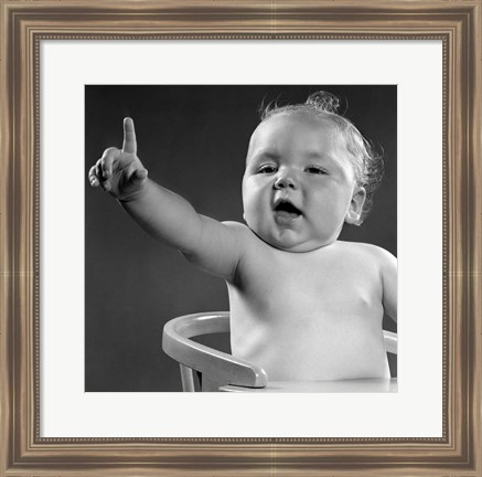 Framed 1940s 1950s Baby Sitting In Chair Arm And One Finger Raised Print