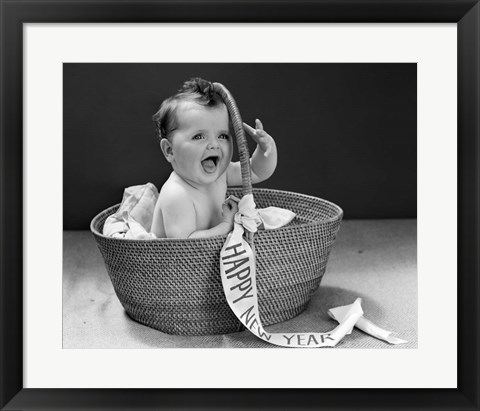 Framed 1940s Baby In Wicker Basket With Happy New Year Banner Print