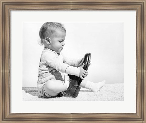 Framed 1960s Baby Boy Trying To Put On Man&#39;S Shoe Print